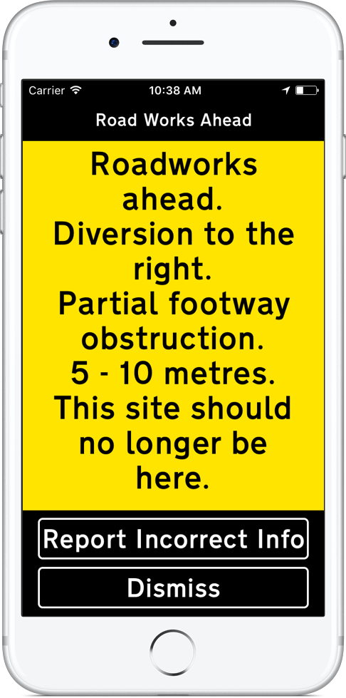 iPhone displaying Roadworks ahead. Diversion to the right. Partial footway obstruction. 5 - 10 metres. This site should no longer be here. In black text on a yellow background